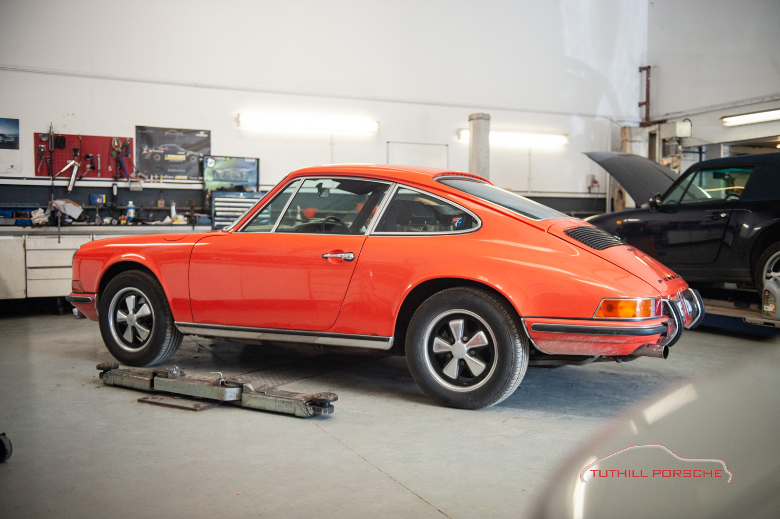 Rare Gulf Orange 1972 Porsche 911E in the service workshop